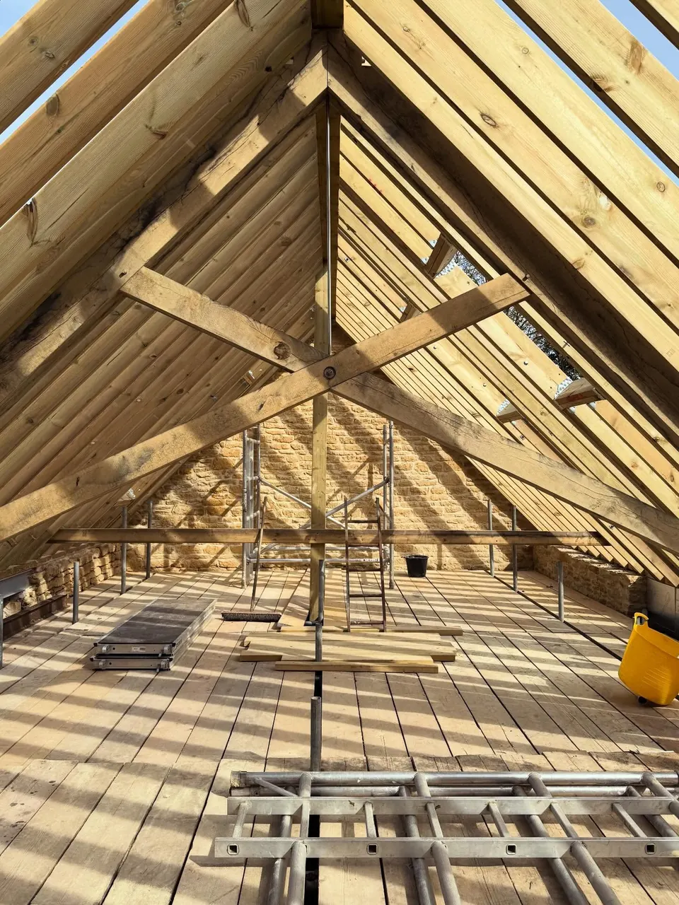 New oak rafters and an X-braced truss inside a barn conversion roof