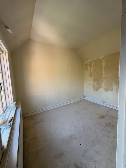 The room before work, with crumbling plaster on the walls