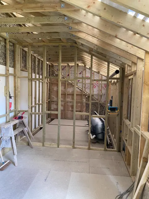 The timber studwork of the new top floor room