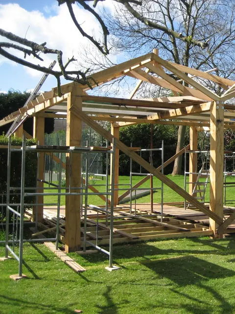 The oak frame of the pavilion going up on its deck