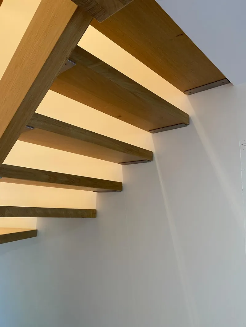 Oak treads of a semi-circular floating staircase seen from above